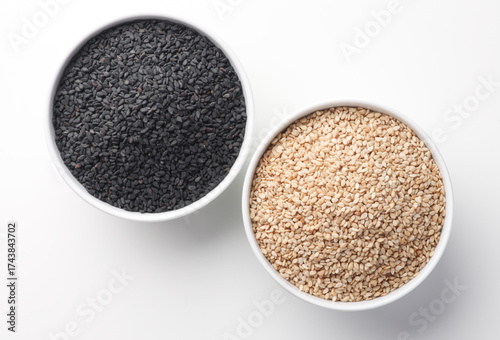 Indian food or seeds called sesame white and black in bowl isolated on white background  