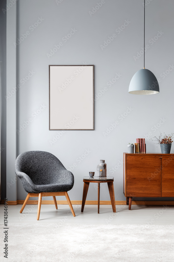 Fototapeta premium Minimalist Interior with Light Gray Wall, Chair, Side Table, and Carpet.
