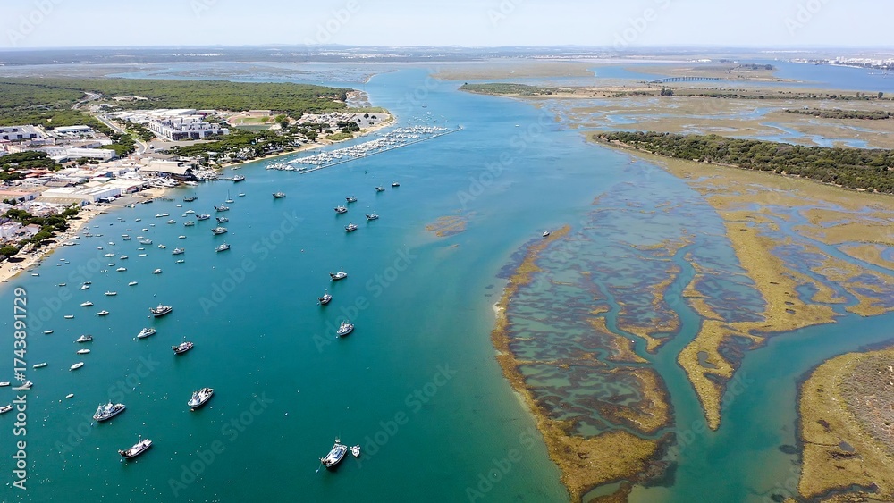 Φωτογραφία Aerial view over the village, marinas and fishing port of Punta Umbría, and the river Piedras, in the Atlantic coast of Huelva, Andalusia, Spain