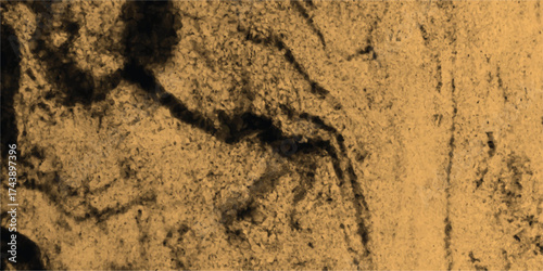 Close up textured background of rough sandy surface with dark abstract shadow patterns and grainy detail in warm sepia tones for a natural feel