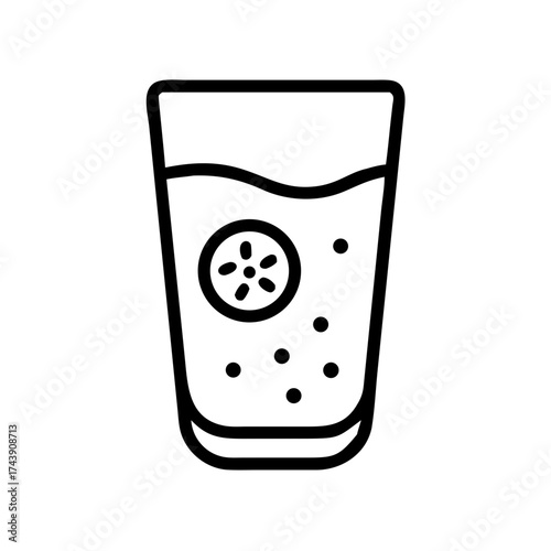 Cucumber-infused water in a glass with floating slices  