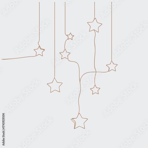 Decorative hanging stars with string accents creating a whimsical and festive atmosphere for celebration or holiday decor