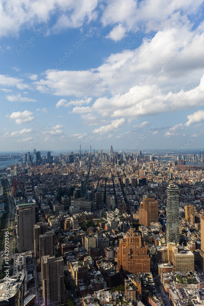Naklejka premium Aerial view of New York City under a cloudy sky