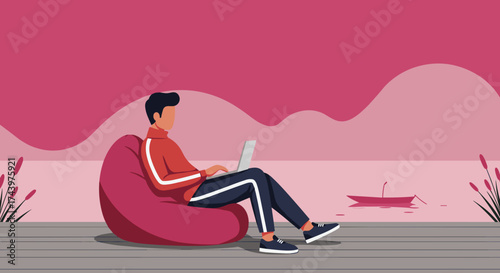 Man on beanbag using laptop by a calm lake embracing remote work and tranquil digital lifestyle