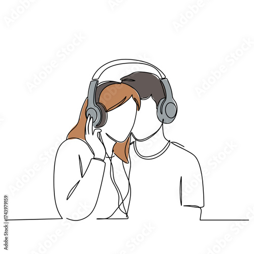 Couple sharing headphones and enjoying music in a cozy setting  
