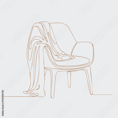 Elegant chair with a flowing fabric draped over it, showcasing minimalist design and soft, neutral tones in a modern setting