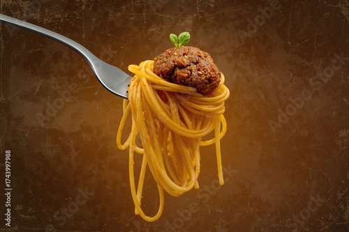 Fork holding spaghetti with...