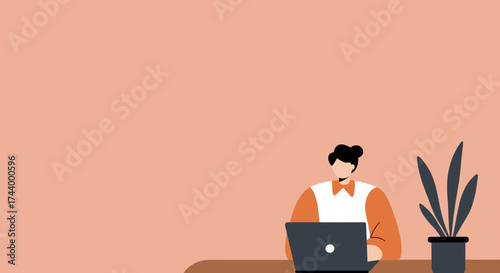 Person working on laptop at a desk with a plant representing remote work and productivity