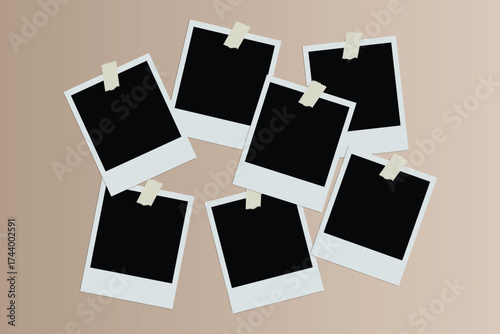 A collection of seven blank instant photo frames, each attached with a piece of tape, arranged in a circular pattern on a neutral background