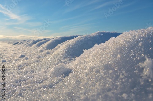 Sunlit snow drifts sparklin...