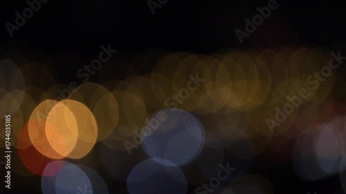 A dreamy blur of colorful lights glows against the night.