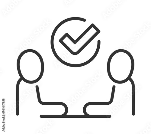 Two people discussing with checkmark icon symbolizing agreement and collaboration