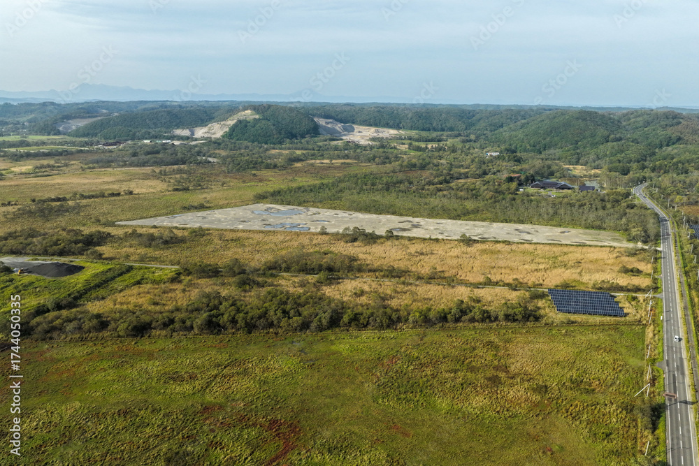 Fototapeta premium Aerial view of a large solar power plant construction site near Kushiro Wetland, Hokkaido, Japan – Editorial Use Only