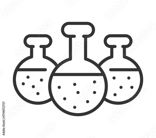 Laboratory glassware: three round-bottom flasks with liquid and bubbles