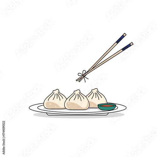 Delicious dumplings served with chopsticks and dipping sauce on a plate.