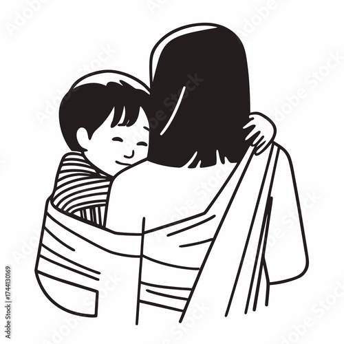 Child being held close in a sling by a person with long hair