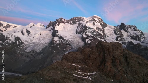 Cinematic aerial drone footage of scenic Swiss Alps. Snow-capped peaks, green valleys, and dramatic mountain landscapes captured in stunning 4K. Ideal for travel, nature, and landscape projects