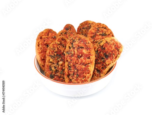 Wallpaper Mural Crispbreads with tomato and oregano in a bowl on white background. Torontodigital.ca