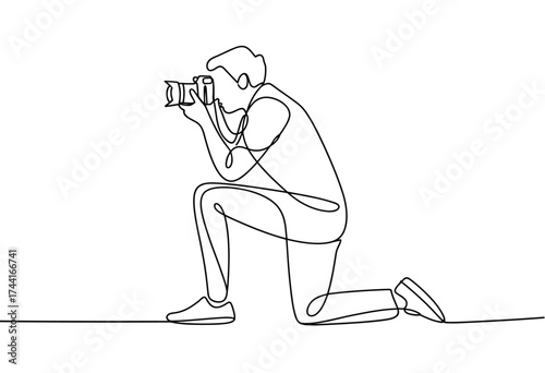 Continuous line drawing captures a photographer kneeling to capture a moment with their camera