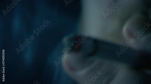 Smoker In Gloomy Dark Area Detail
