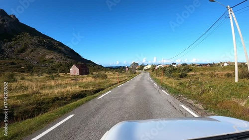 Driving on the road through the driver's perspective in the beautiful Norwegian landscape