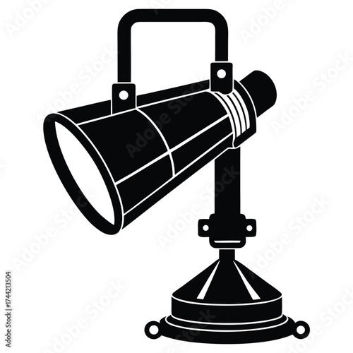 Black silhouette of a studio spotlight on a stand Keywords: spotlight, studio light, stage lighting, theater