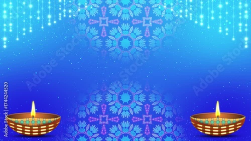 Diwali holiday decoration clip and decorated Diya lamp, bright particles background in blue gradient colours.