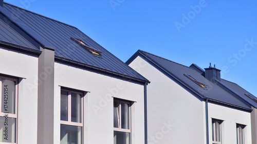 Newly built terraced houses in a residential area. Modern terraced houses on the outskirts of the city.