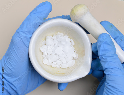 Potassium hydroxide KOH, and is commonly called caustic potash