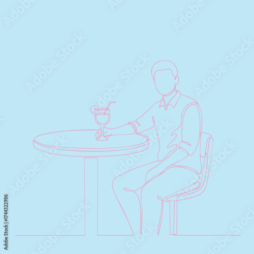 Relaxed man sitting at a round table with a drink and straw in a casual setting, enjoying leisure time outdoors or in a cafe environment