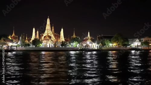 Wat Arun at Night - A Stunning Riverside View in Bangkok.