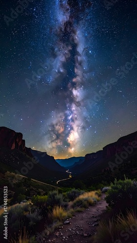 Milky Way ascends over canyon.  Night sky panorama