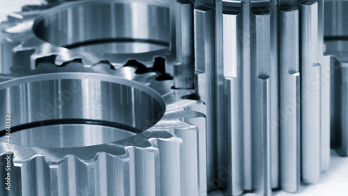 Fotografie A close up of a set of gears with the top gear being the largest