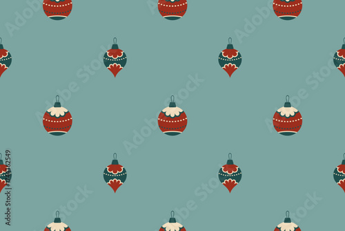Seamless vector pattern with Christmas ornaments in flat retro style baubles, in muted red and green tones. Perfect for festive wrapping and backgrounds. Isolated gray background