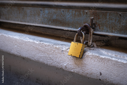 closed and padlocked shop shutters. economic crises and bankruptcies.