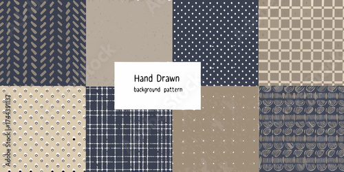 Collection of eight hand drawn seamless geometric patterns in earth tones and navy blue