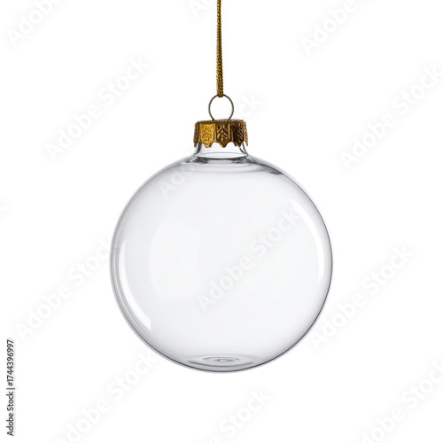Isolated clear glass Christmas ornament suspended by golden cap on black background