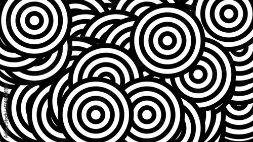 Overlapping Concentric Circles in a Chaotic Black and White Abstract Pattern.