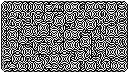 Overlapping Concentric Circles in a Chaotic Black and White Abstract Pattern.