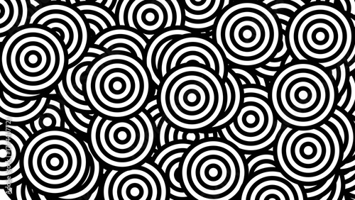 Overlapping Concentric Circles in a Chaotic Black and White Abstract Pattern.