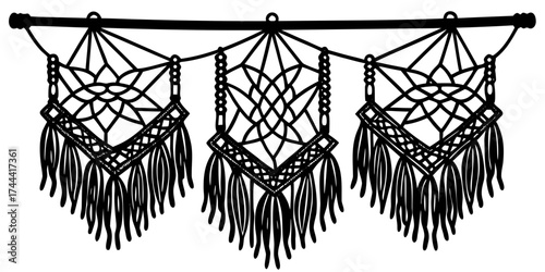 Elegant macrame wall decor with intricate patterns and fringes hanging from a wooden rod.