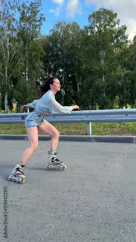 Caucasian woman rollerblading fast on road. 