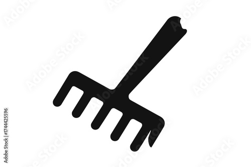 Black silhouette of a garden rake on white background