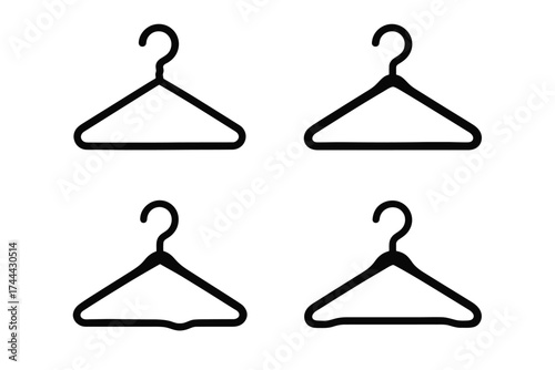 Set of four simple black clothes hangers on white background