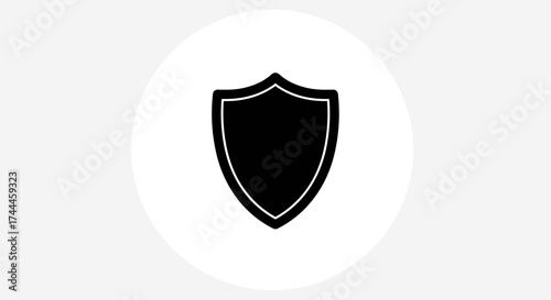 Black Shield Icon on White Circle Background.