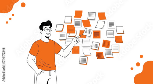 A man in glasses points to a collection of notes on the whiteboard