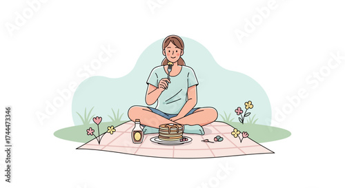 A woman enjoying pancakes during a picnic in the park for a relaxing experience