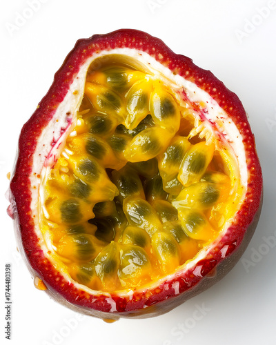 Freshly cut passion fruit showcasing translucent sacs and golden pulp on a white background