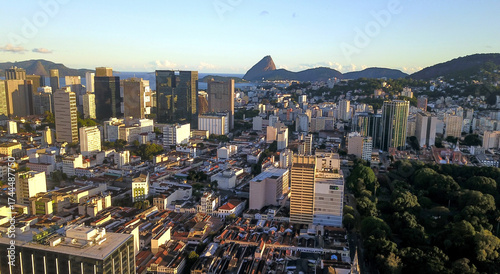 Tableau sur toile Rio de Janeiro, Brazil - November 5, 2022 - Aerial view of the city center, with Guanabara Bay and Sugarloaf Mountain in the background, in the late afternoon, with a clear sky