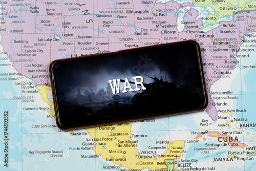 an a smart phone with a composition image of war word over a north american political map